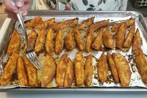 Bake the potato wedges in the preheated oven