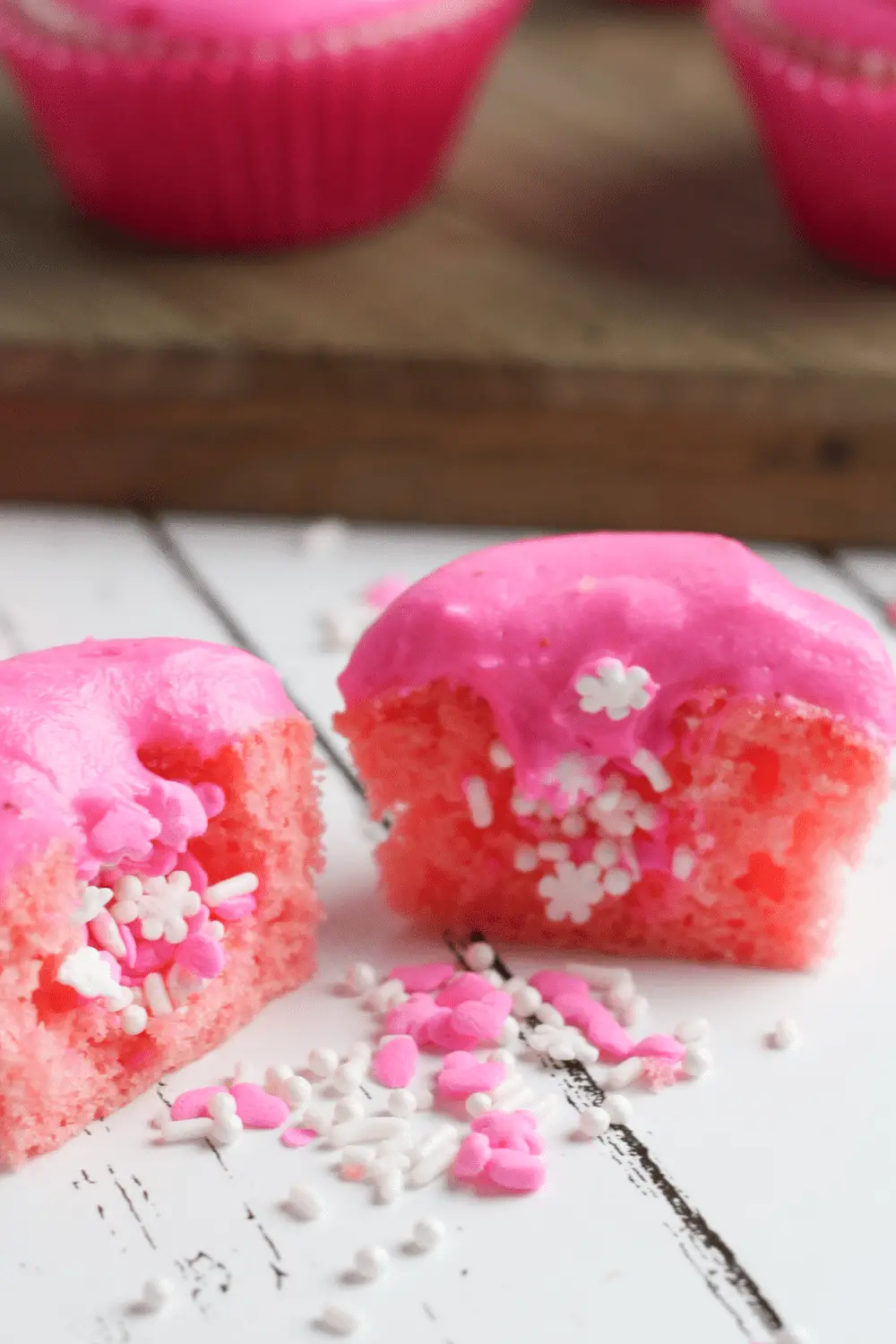Sprinkle Filled Cupcakes with Strawberry Buttercream Frosting
