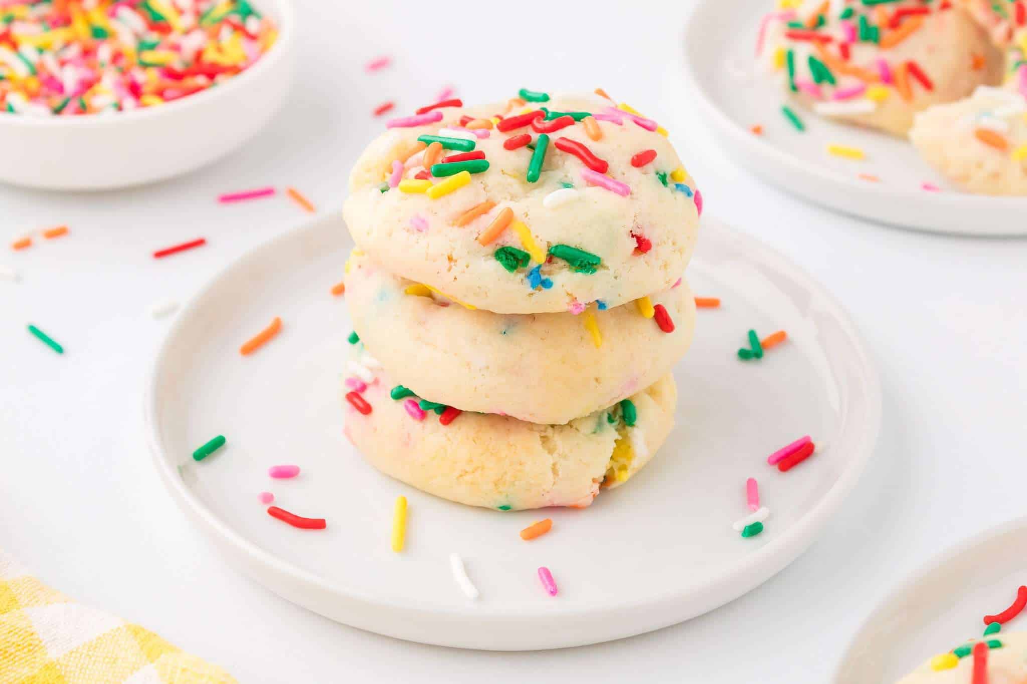 Funfetti cake mix cookies in a stack on a plate