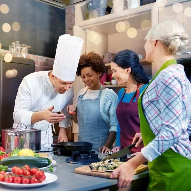 take mom to a group cooking class for an experience gift instead of buying her a traditional gift