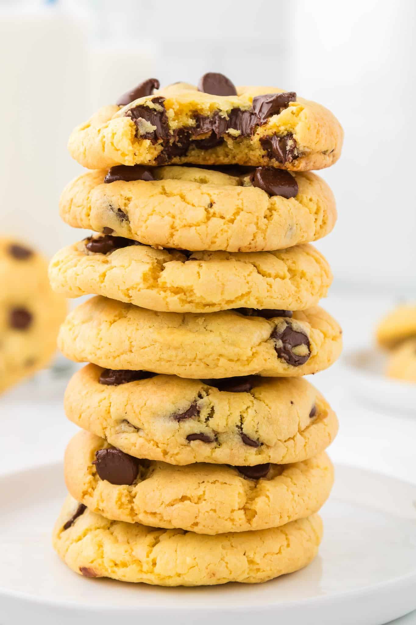 yellow cake mix cookies stacked on top of each other with gooey chocolate chips