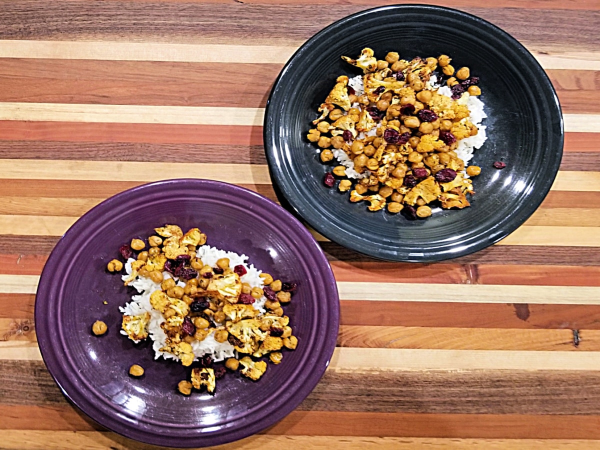 chick peas and cauliflower on two plates for serving