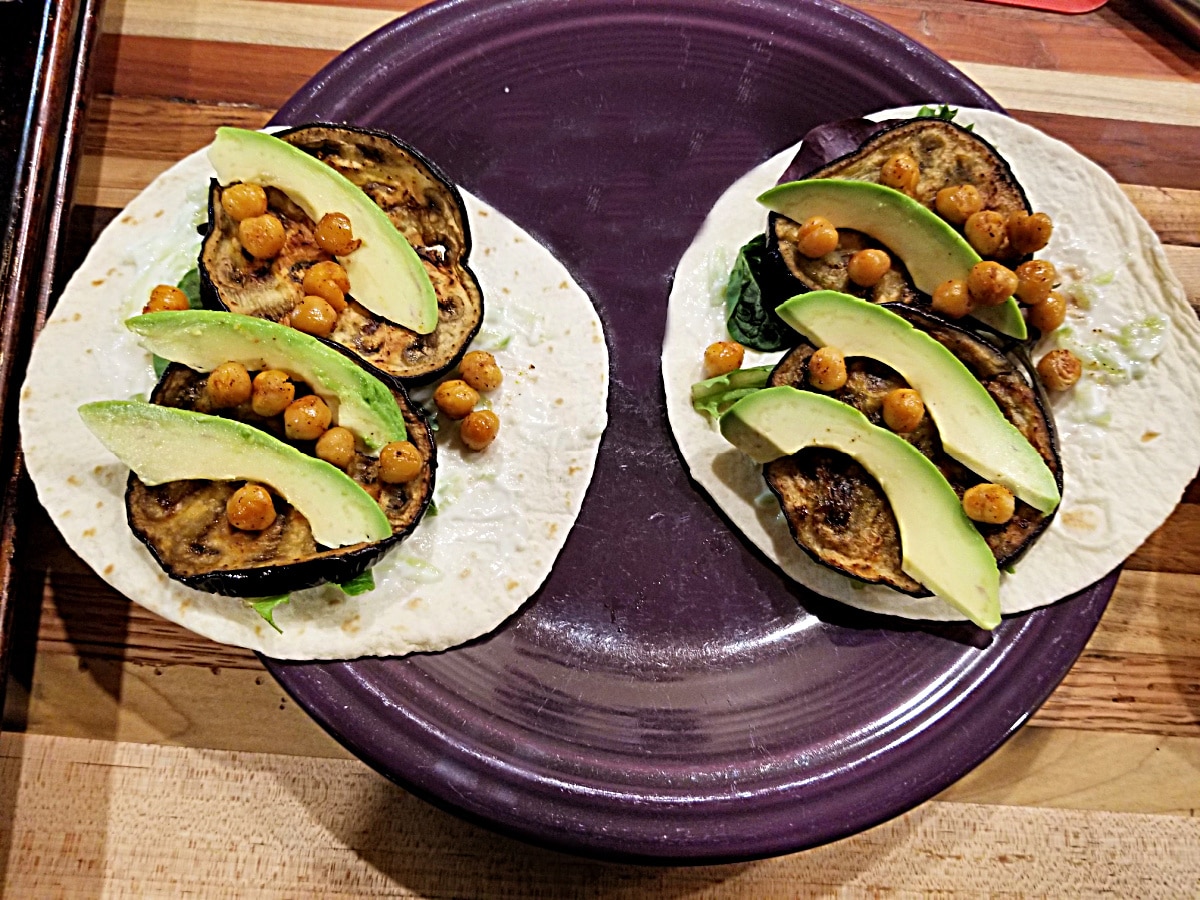 roasted eggplant tortilla wraps on purple plate