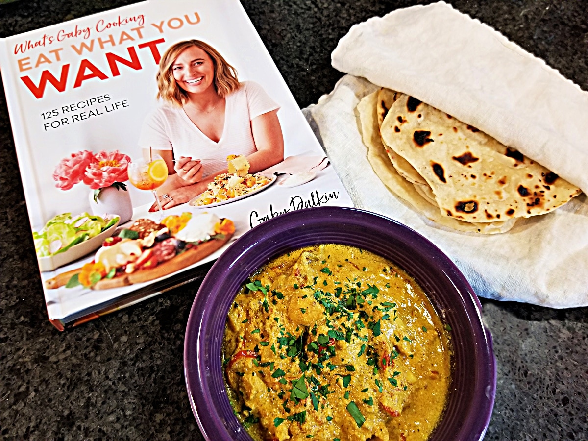 butter chicken and roti with cookbook